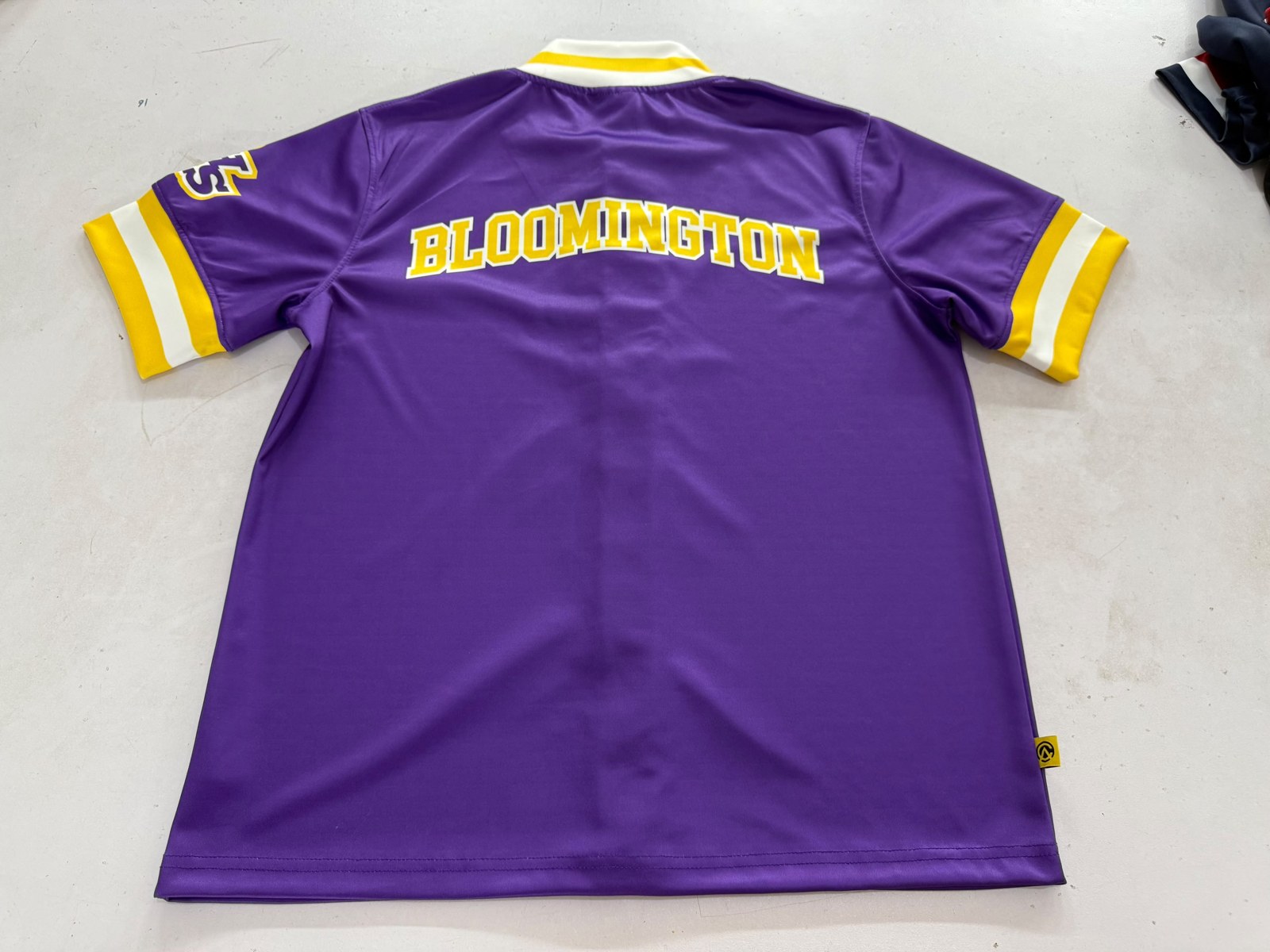 The back, with BLOOMINGTON across the shoulders